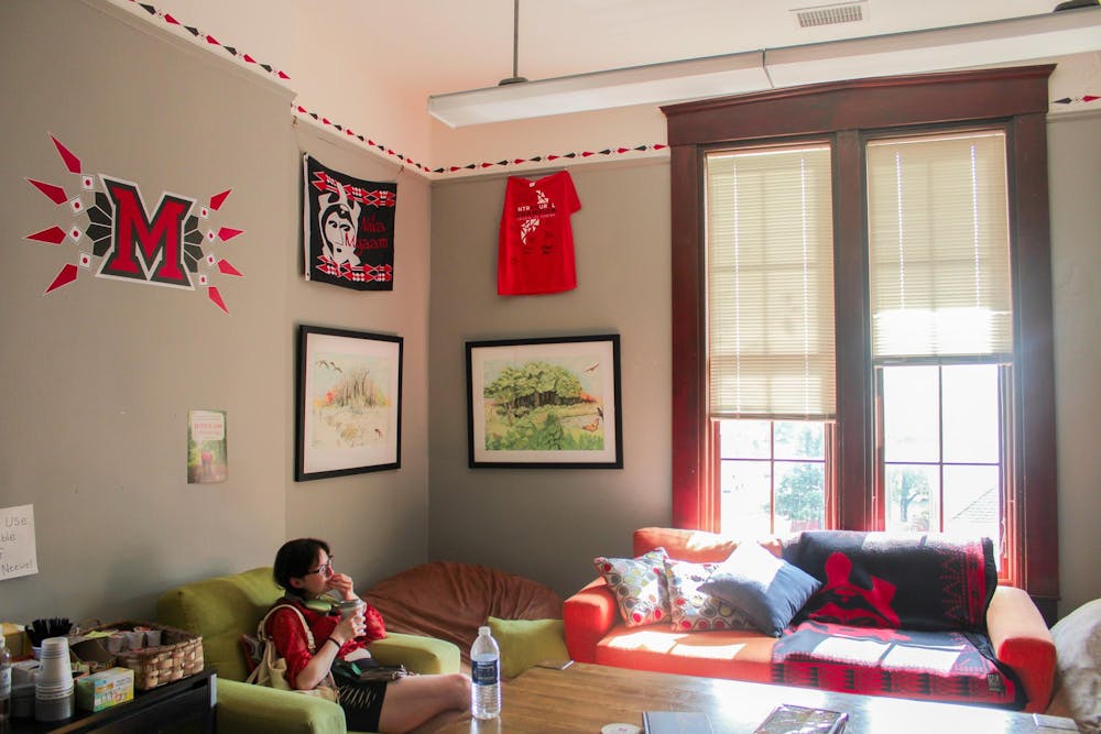 Student sits in lounge room in the Myaami Center on campus. Photo by.