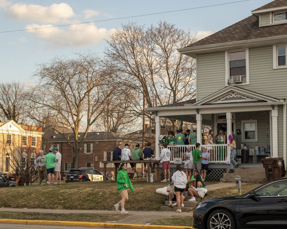 Students enjoy an outdoor daytime party on Green Beer Day, one of Oxford's sunnier springs days.