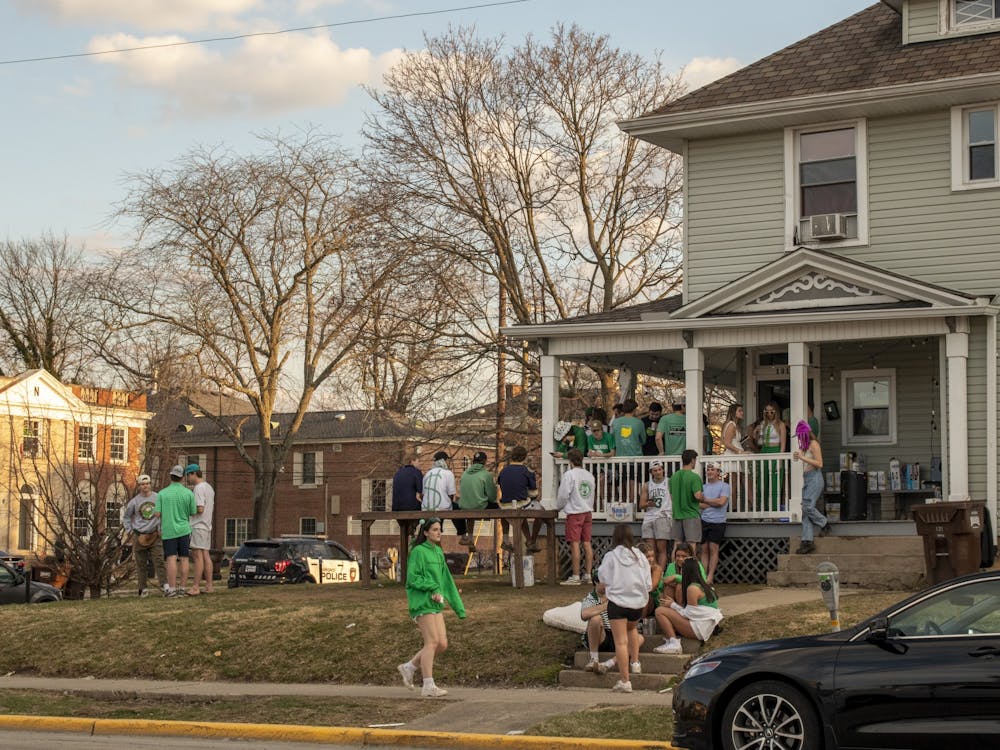 Students enjoy an outdoor daytime party on Green Beer Day, one of Oxford's sunnier springs days.