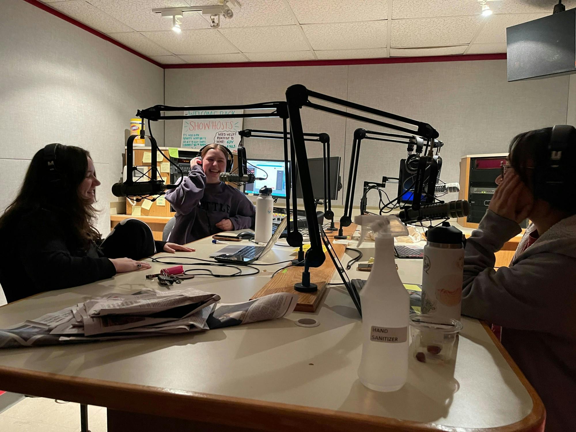 Mary Hines, Abbie Stoner and Connor Donaldson go on-air, sharing their camaraderie through their radio show “The Debrief.”