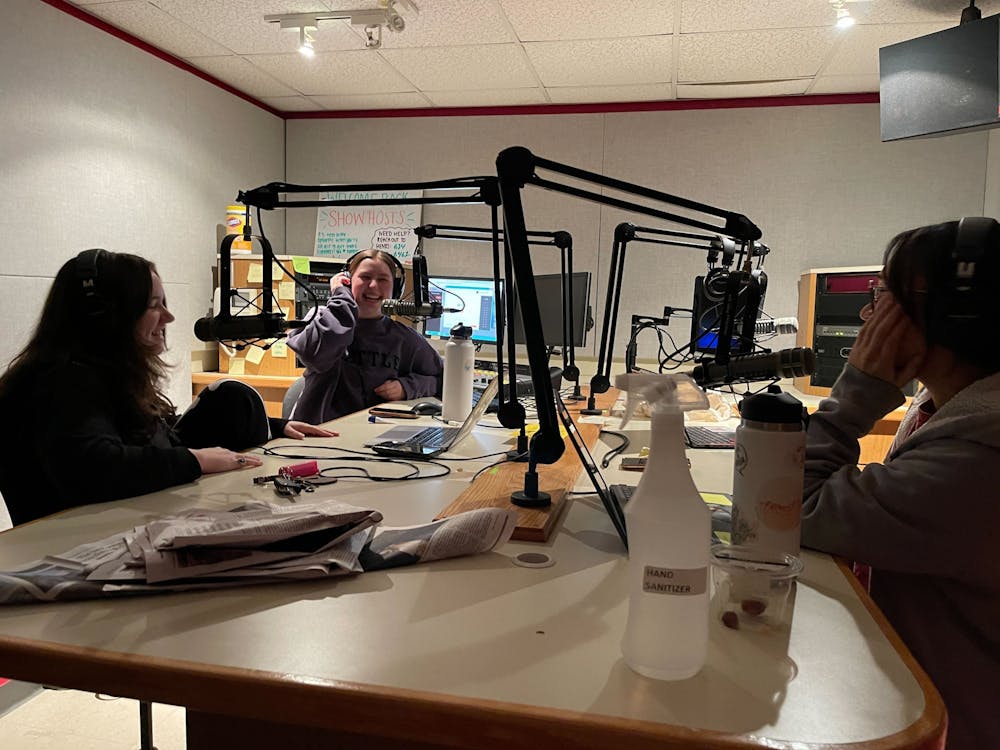 Mary Hines, Abbie Stoner and Connor Donaldson go on-air, sharing their camaraderie through their radio show “The Debrief.”