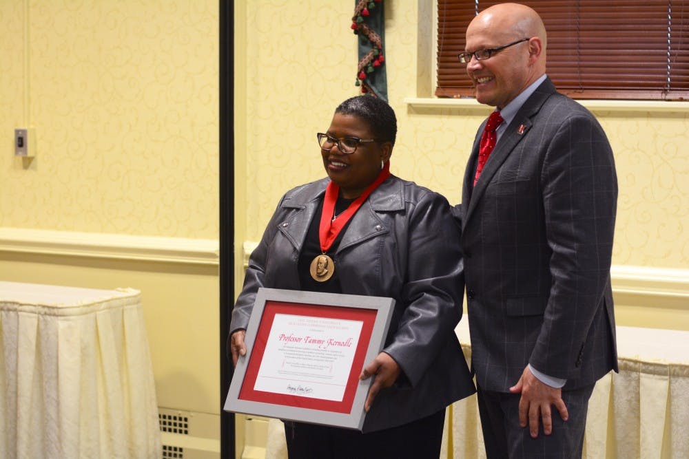 Tammy Kernodle receives Benjamin Harrison Medallion.