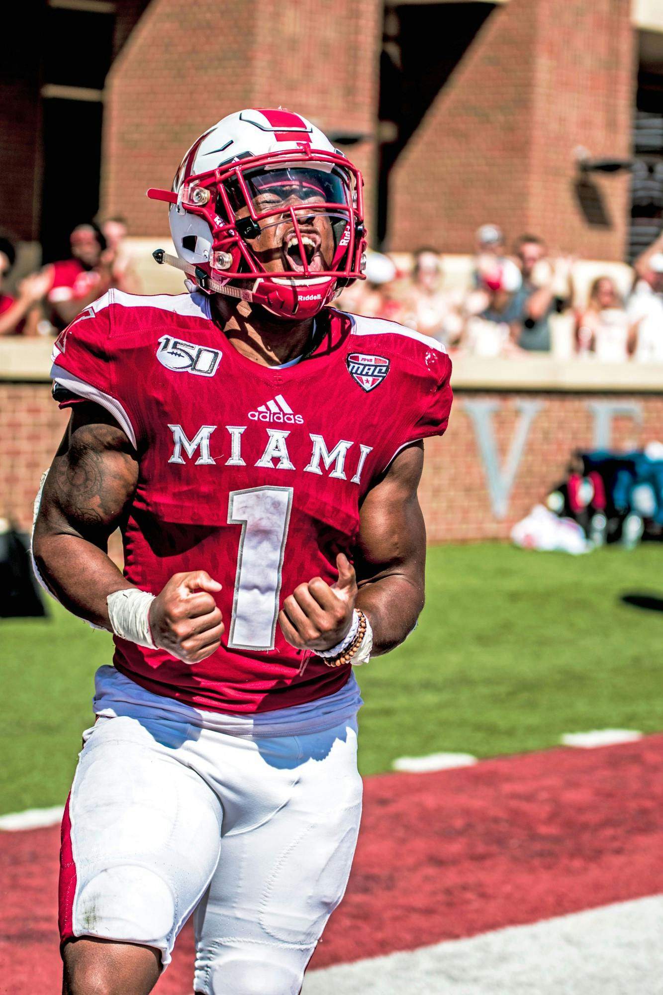 Jaylon Bester yells in excitement after a short touchdown run against Buffalo on Sept. 28 at Yager Stadium.