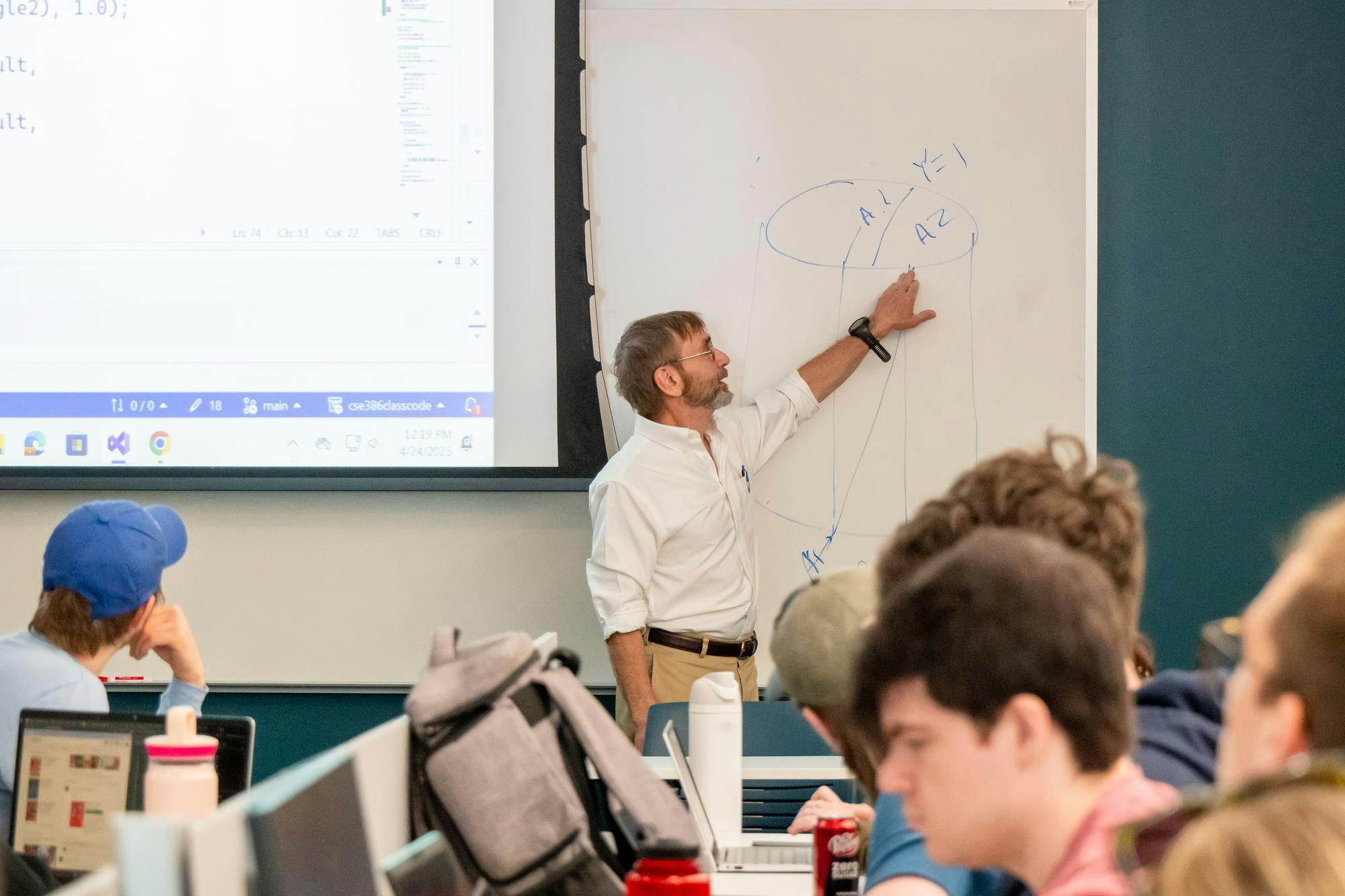 Professor Eric Bachmann teaching his 11:40 a.m. class in the McVey Data Science building.