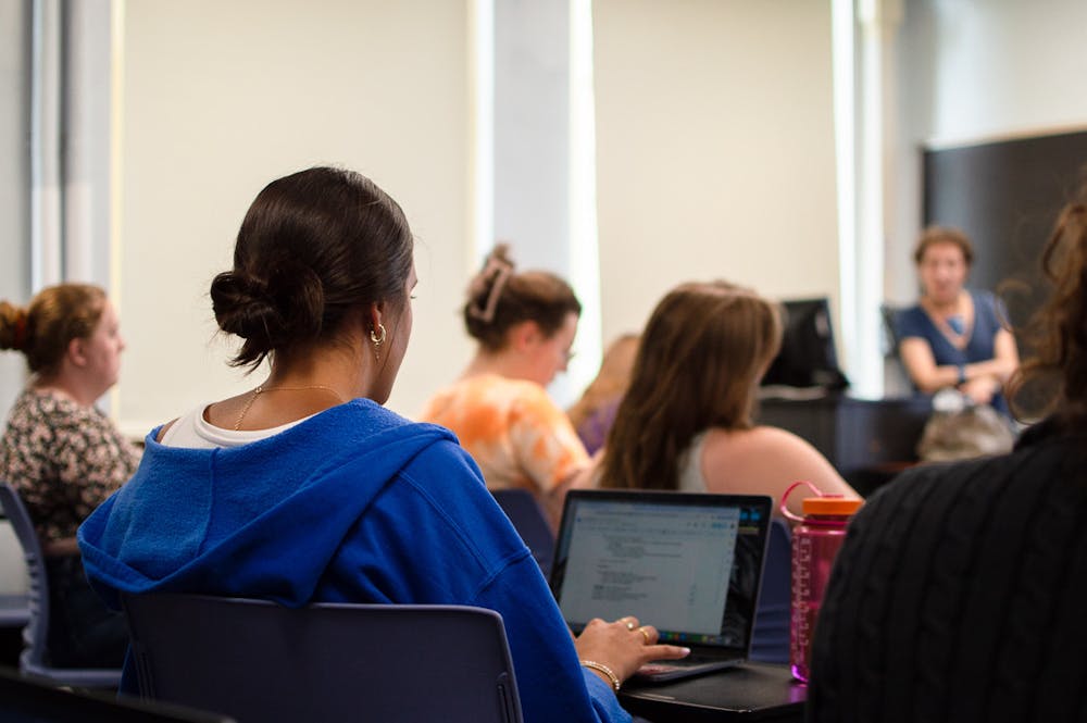 Students in Dr. Deborah Lyons' CLS 210 class discuss their reading on ancient religions.