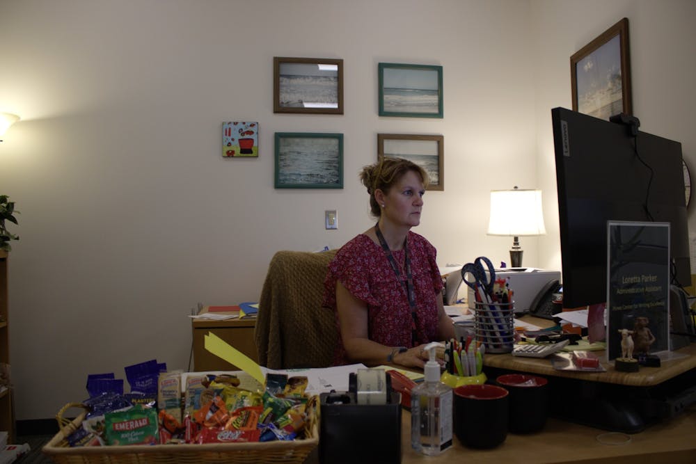 Loretta Parker, an administrative assistant in the Howe Center for Writing Excellence sits at her desk in King Library where she uses Workday for many aspects of her job.