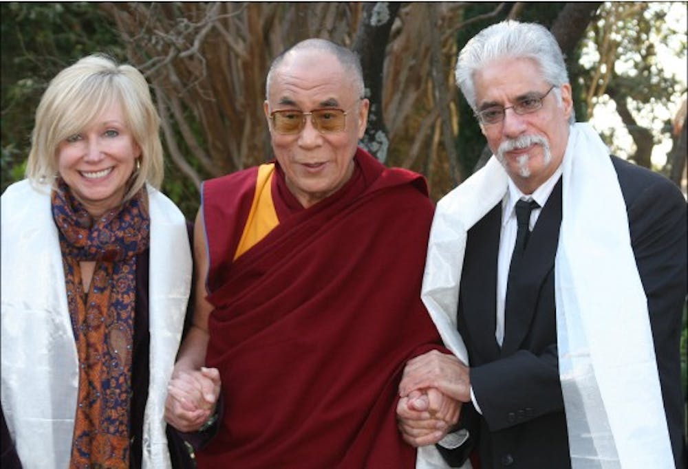 Deborah Akers and Homayun Sidky pictured with the Dalai Lama are both professors of anthropology.  They currently teach the semester-long program for Miami students in Dharamsala, India.