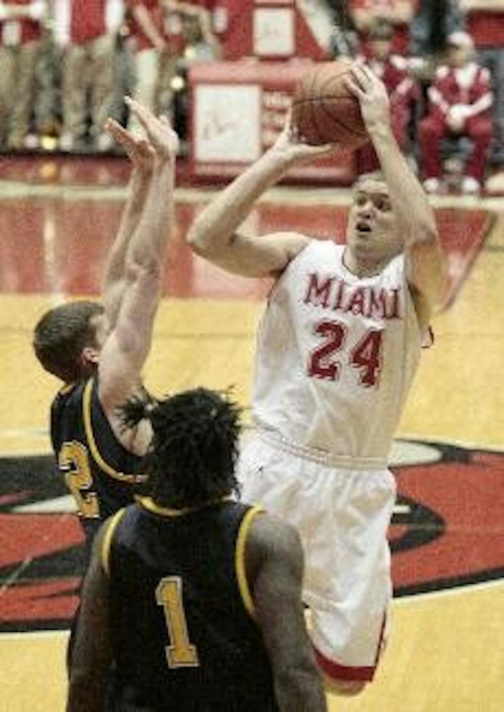 Miami's Michael Bramos shoots over two Kent State defenders during Thursday night's loss at Millett Hall. The RedHawks have now lost five games in a row and are 0-3 in MAC play.