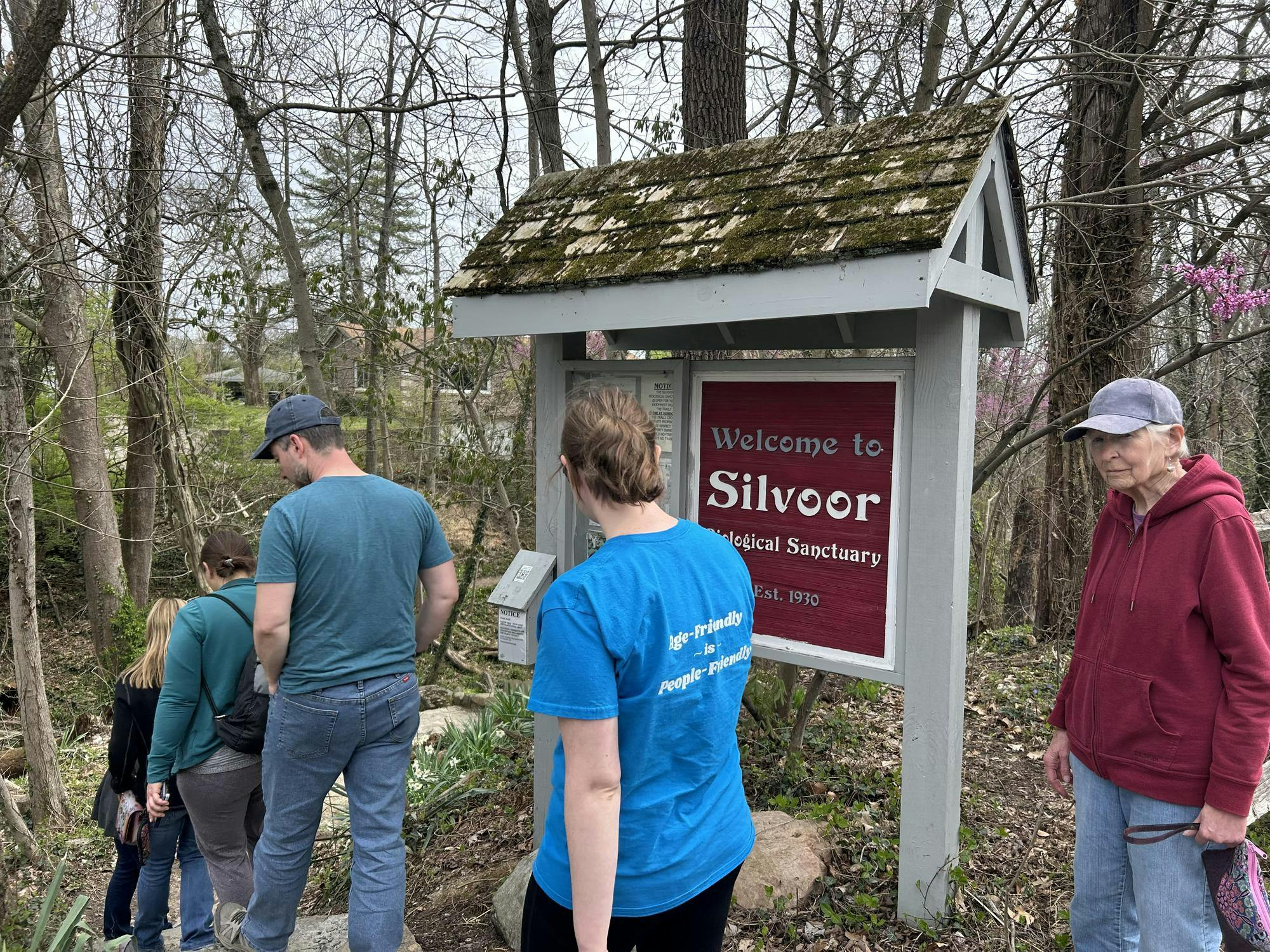 Attendees walk into Silvoor Biological Sanctuary during this week's Wildflower Walk.