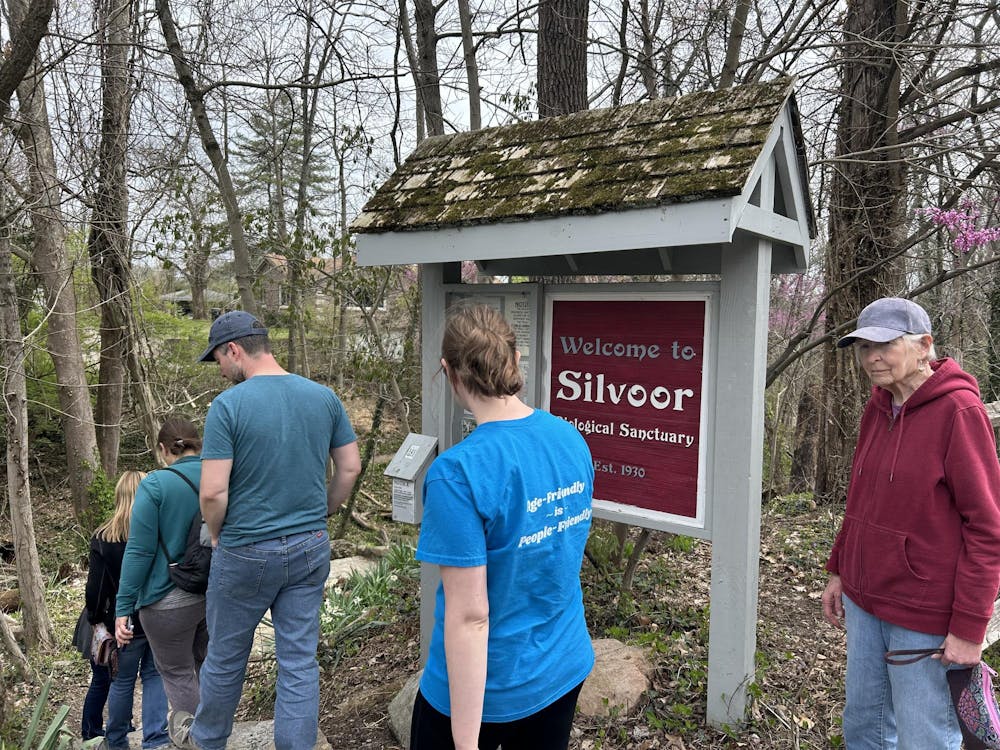 Attendees walk into Silvoor Biological Sanctuary during this week's Wildflower Walk.