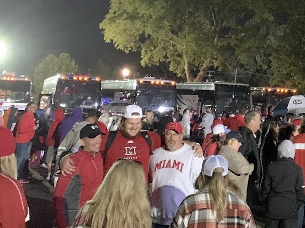 Miami fans celebrate in the rain outside Ryan Field after the RedHawks’ 17-14 upset over Northwestern.