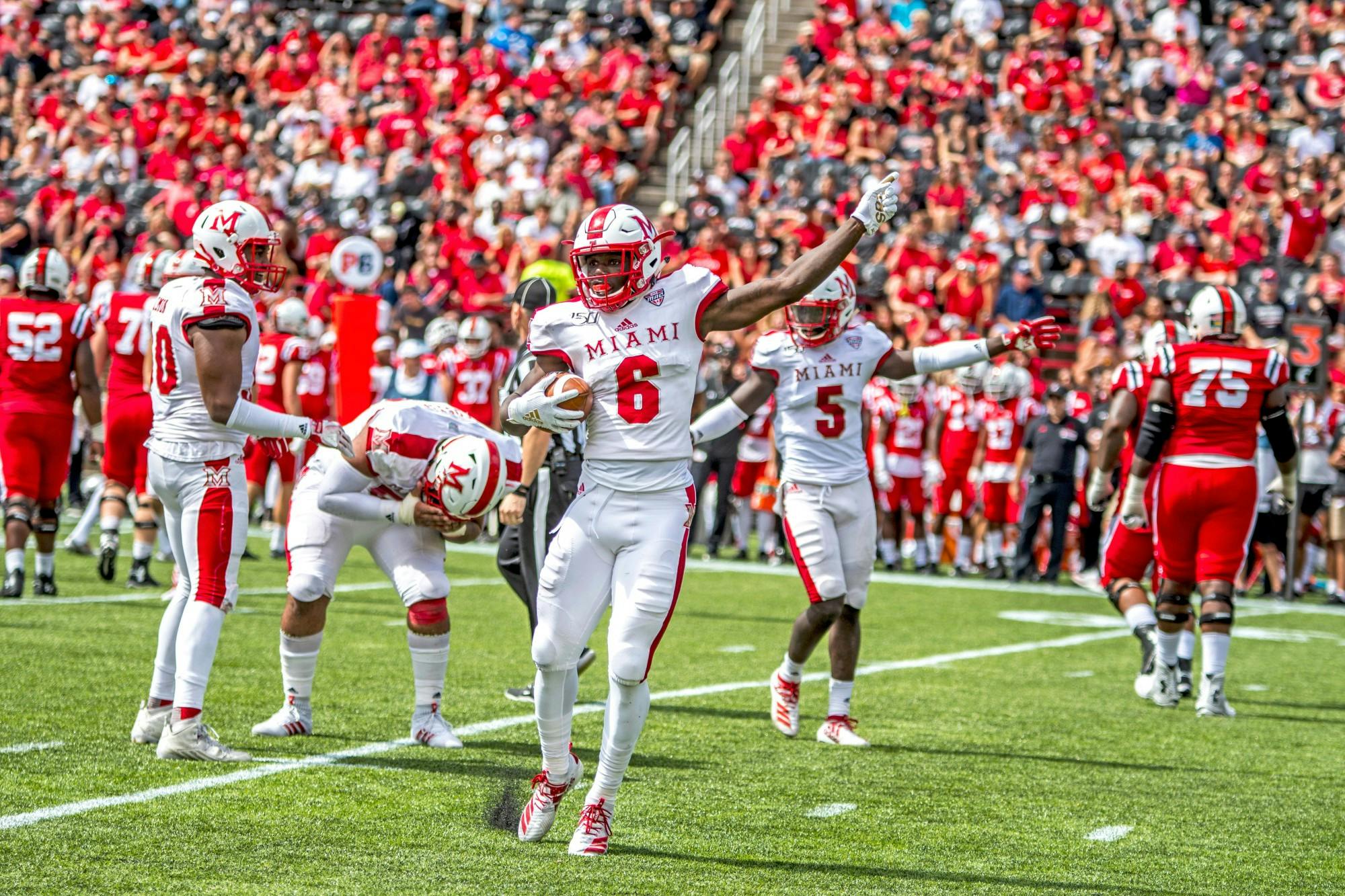 Miami&#x27;s defense held Louisiana&#x27;s 11th ranked scoring offense in check, but Chuck Martin described trying to tackle Louisiana quarterback and LendingTree Bowl MVP Levi Lewis like &quot;Rocky Balboa chasing the chicken.&quot;
