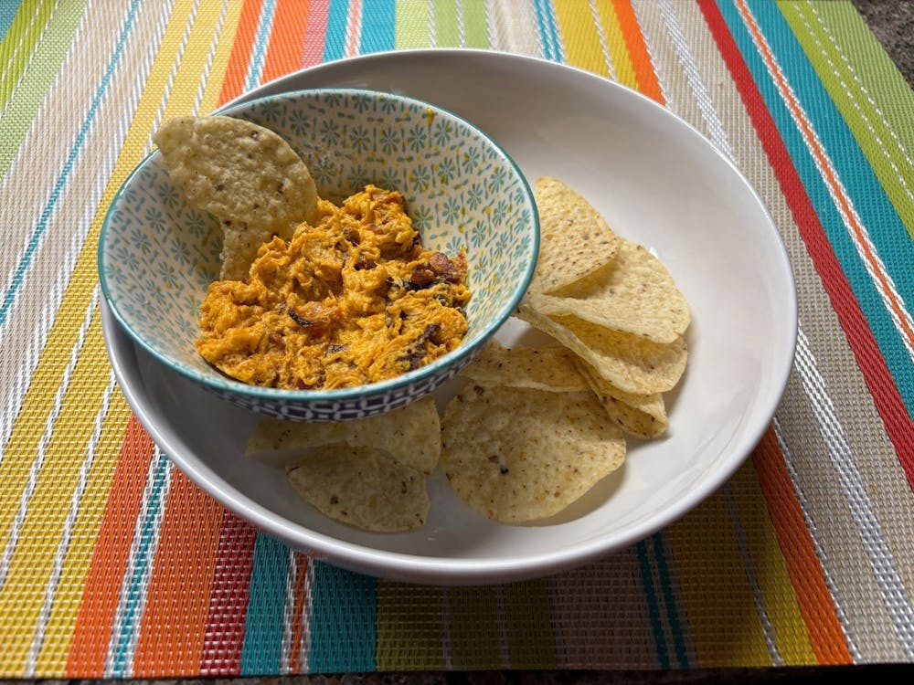 Perkins' Buffalo Chicken Dip is the perfect dish to bring to your next potluck or party, served with chips or celery.