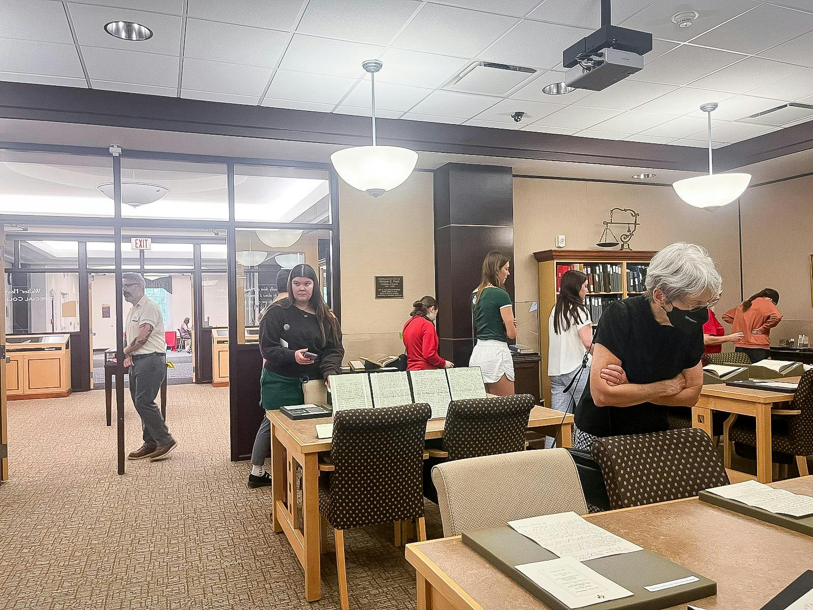 People look at Wells Hall time capsule archives in King Library.
