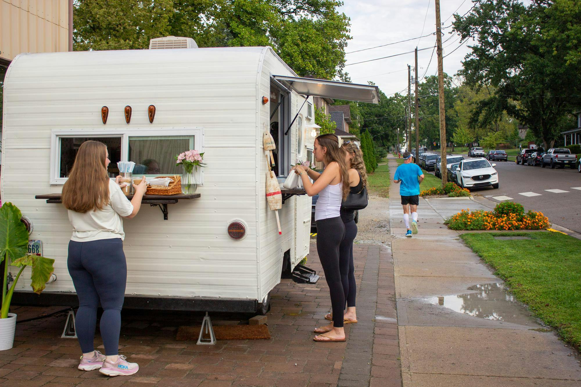 People order drinks from Daybreak Coffee Truck outside of Shademakers Garden Center.