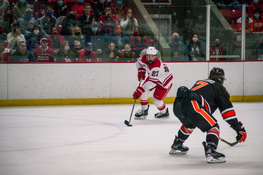 <p>Sophomore defenseman Dylan Moulton controls the puck in Miami&#x27;s Oct. 22 tie vs. Bowling Green</p>