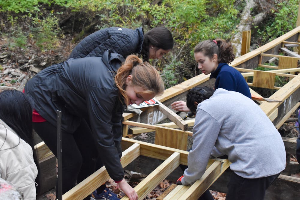 <p>Author Parker Green and other Engineers Without Borders attempt to build a sleigh with little to no instruction. Photo provided by Brooklyn Lengyel</p>