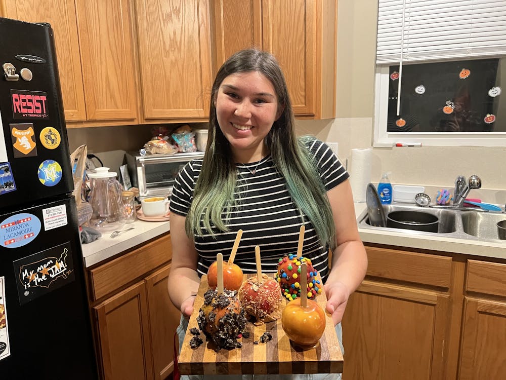 Asst. Entertainment Editor Maggie Peña is, quite literally, a caramel apple-making pro.