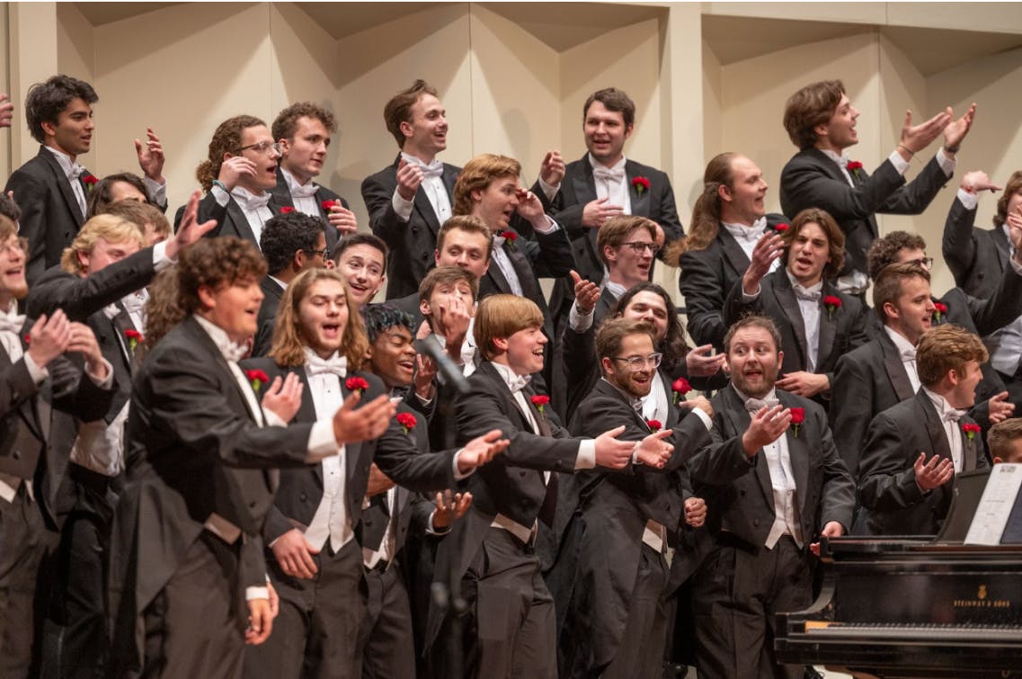 Members of the Men's Glee Club perform in Hall Auditorium.