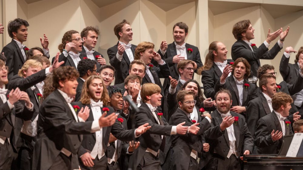 Members of the Men's Glee Club perform in Hall Auditorium.