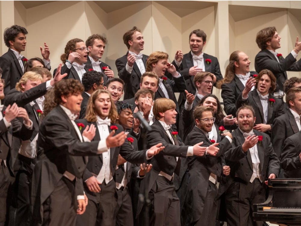 Members of the Men's Glee Club perform in Hall Auditorium.