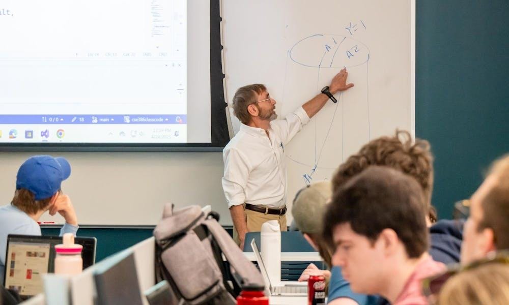 Professor Eric Bachmann teaching his 11:40 a.m. class in the McVey Data Science building.