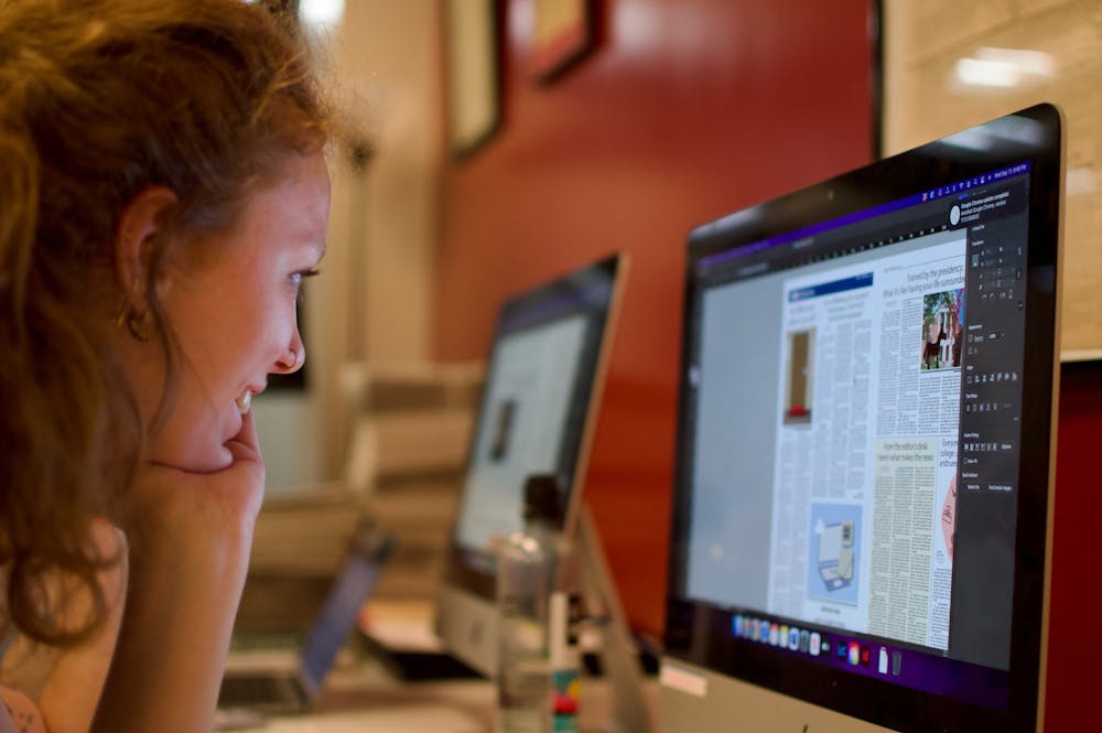 Macey Chamberlin looks intently on one of our news spreads on one of The Student’s production nights.