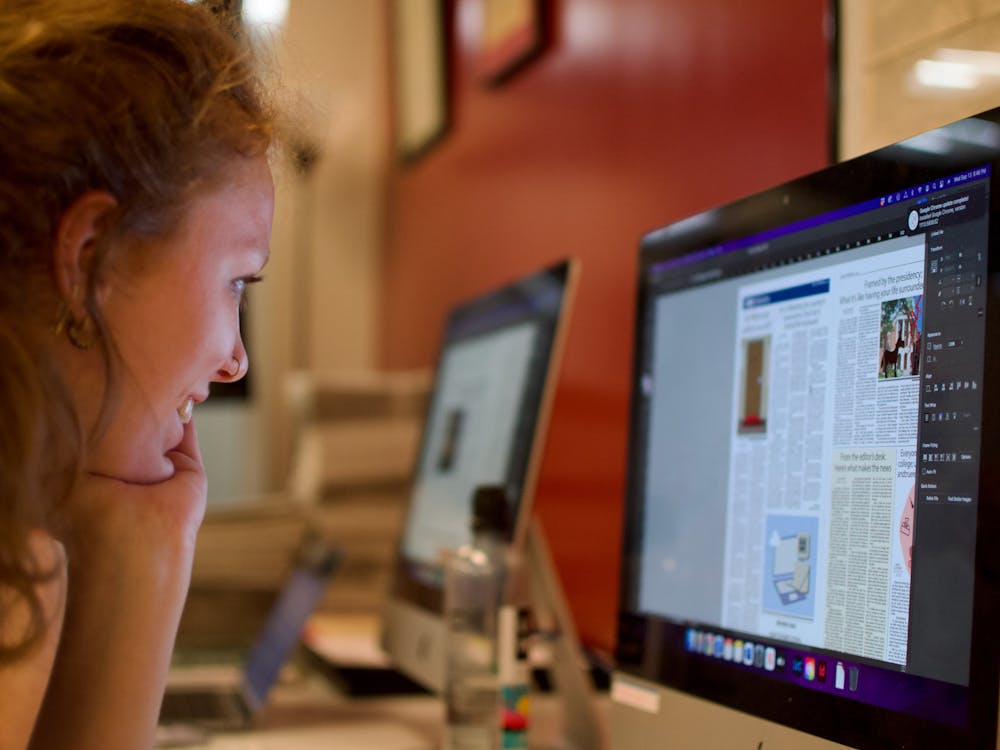 Macey Chamberlin looks intently on one of our news spreads on one of The Student’s production nights.