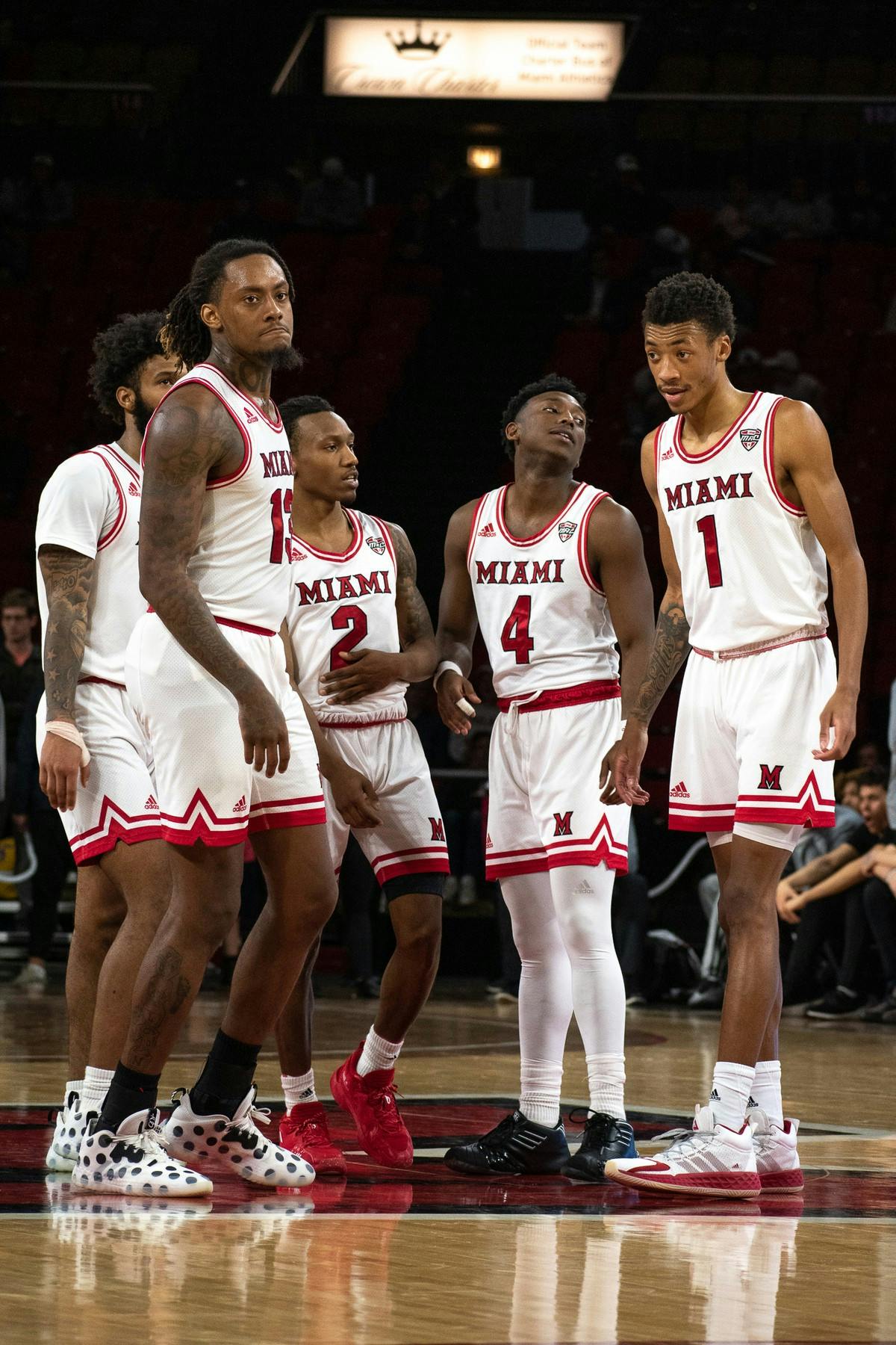 The Miami men&#x27;s basketball team (from left to right: junior guard Dae Dae Grant, senior forward Dalonte Brown, senior guard Mekhi Lairy, redshirt senior guard Isaiah Coleman-Lands and sophomore forward Kamari Williams) talk at halfcourt during a March 4 matchup against Eastern Michigan.