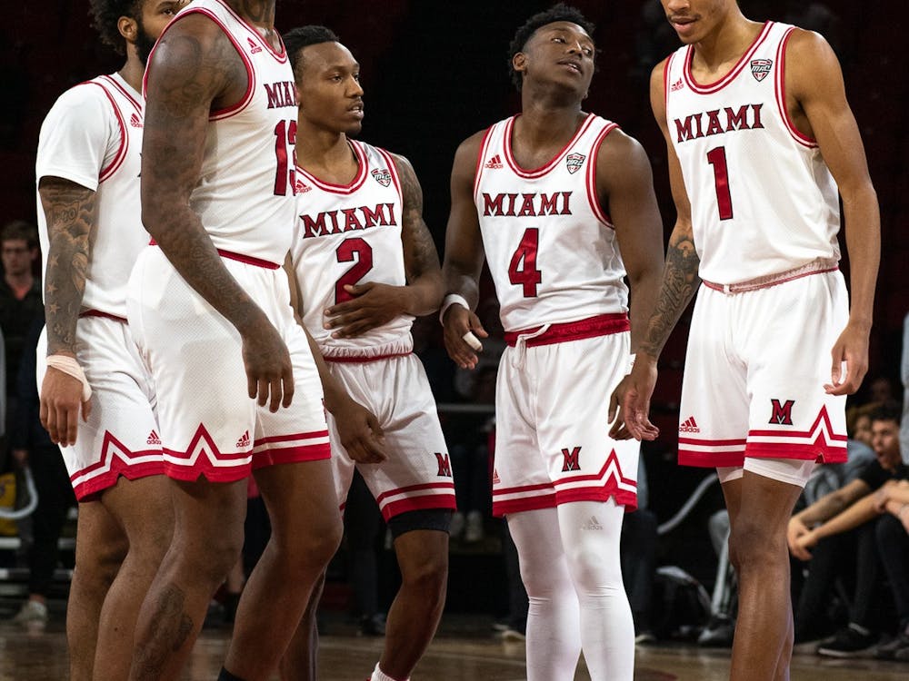 The Miami men&#x27;s basketball team (from left to right: junior guard Dae Dae Grant, senior forward Dalonte Brown, senior guard Mekhi Lairy, redshirt senior guard Isaiah Coleman-Lands and sophomore forward Kamari Williams) talk at halfcourt during a March 4 matchup against Eastern Michigan.