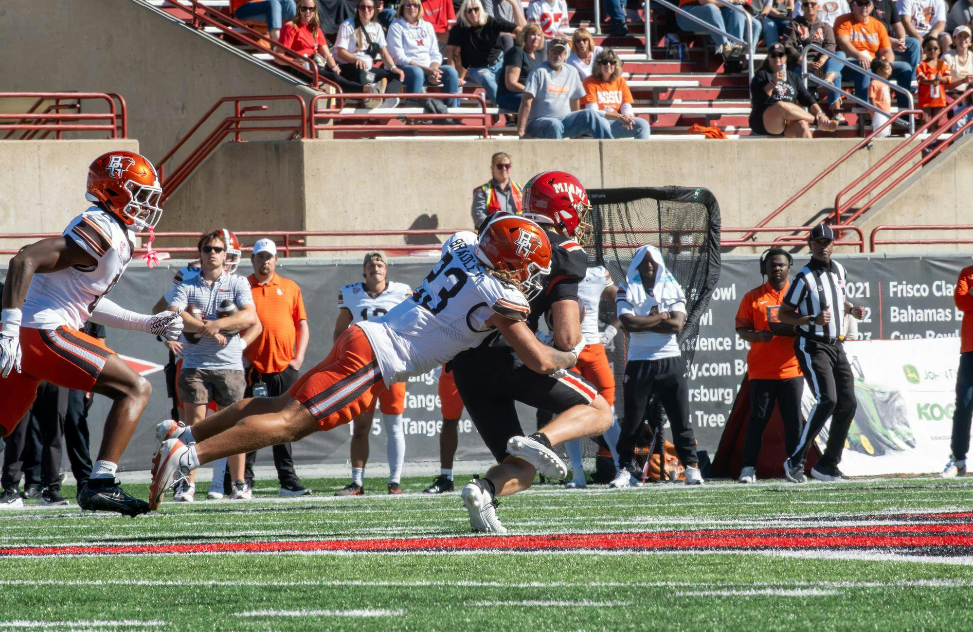 Senior quarterback Caleb Heavner gets tackled by Bowling Green State University defender in game on Oct. 3, 2026.