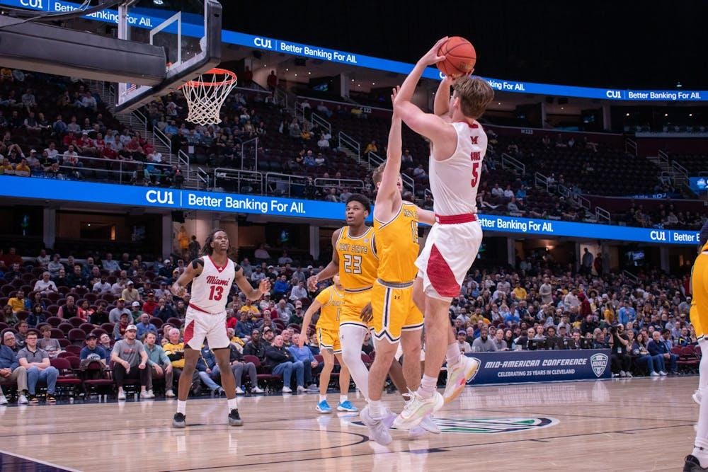 Senior guard Peter Suder takes a shot against Kent State at last season's MAC semifinals at Rocket Mortgage Arena
