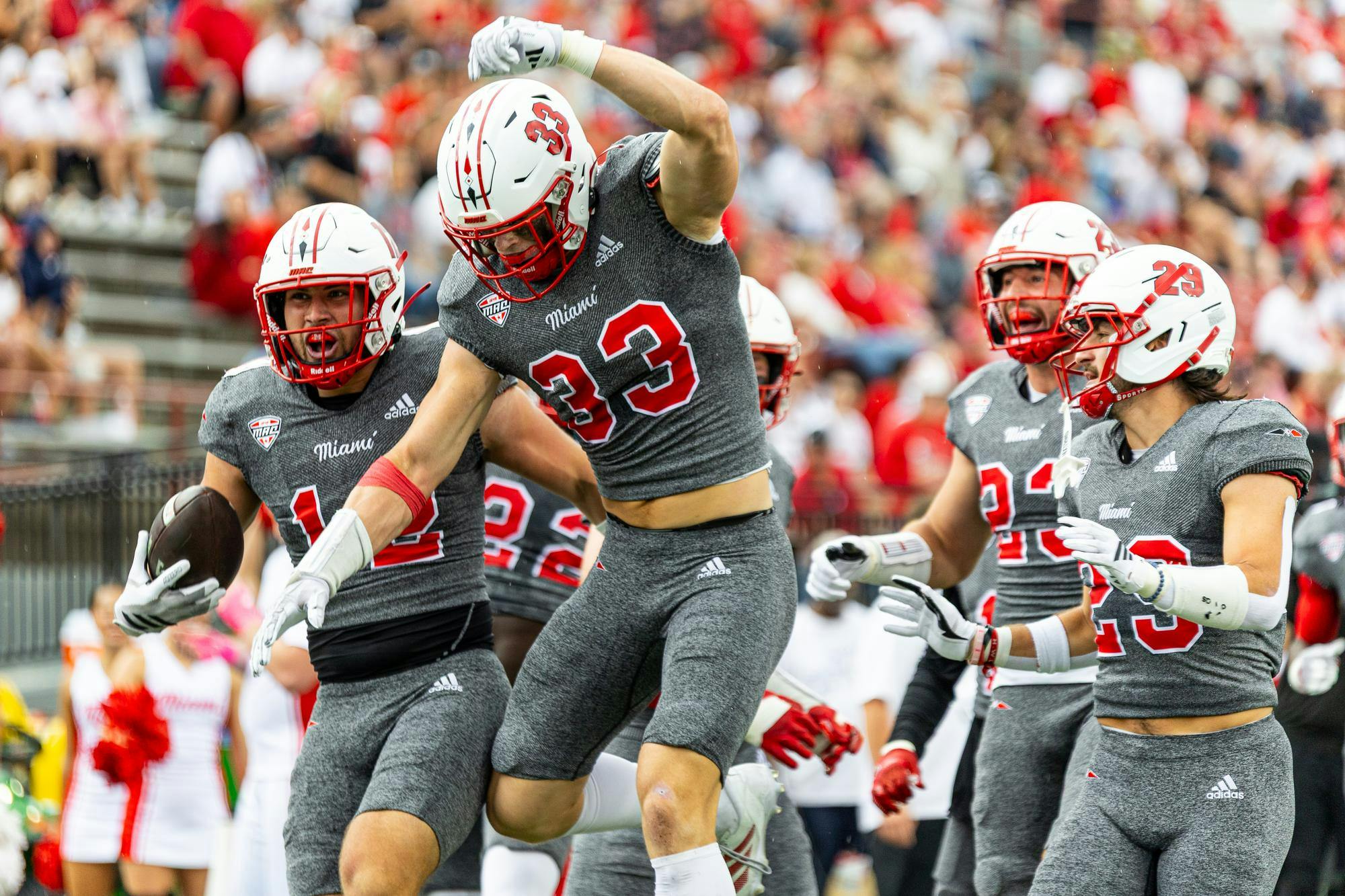 Miami's defense celebrates Corban Hondru's (far left) interception in the second quarter against Eastern Michigan on Oct. 18 at Yager Stadium