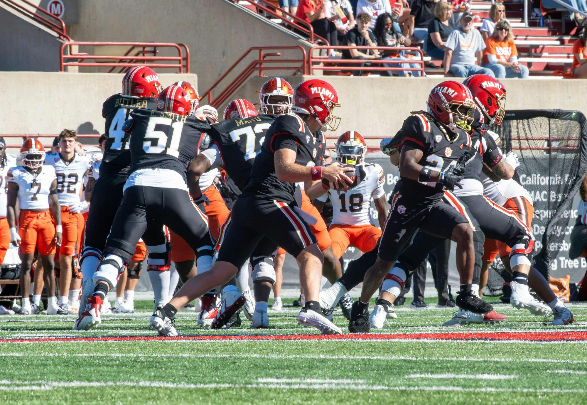 Quarterback Caleb Heavner looks to scramble in game against Bowling Green.