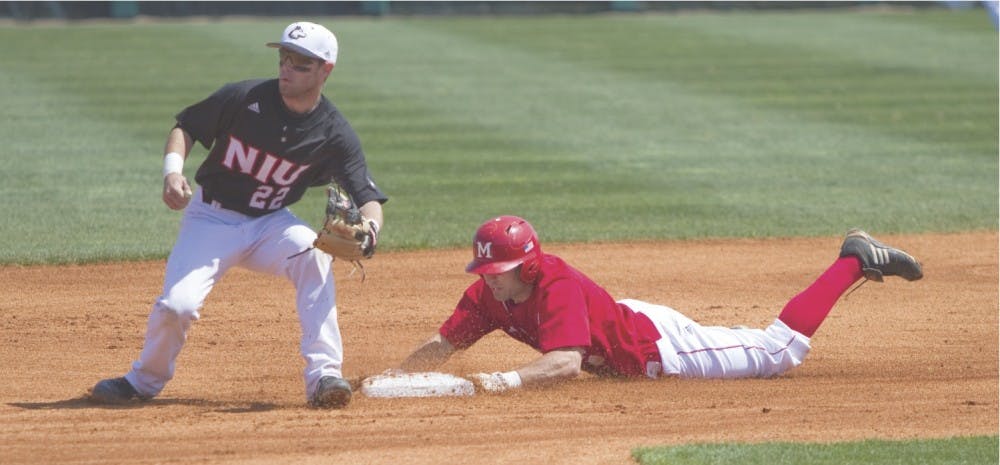 Junior Adam Eaton slides safely into second base before Northern Illinois University’s Alex Beckmann can tag him out April 11.