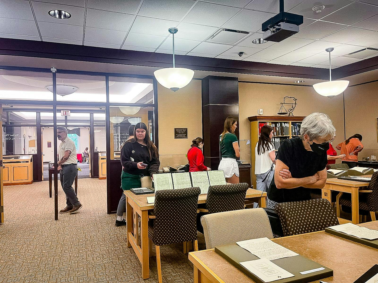 Viewers walk around King Library to look at the Wells hall time capsule.