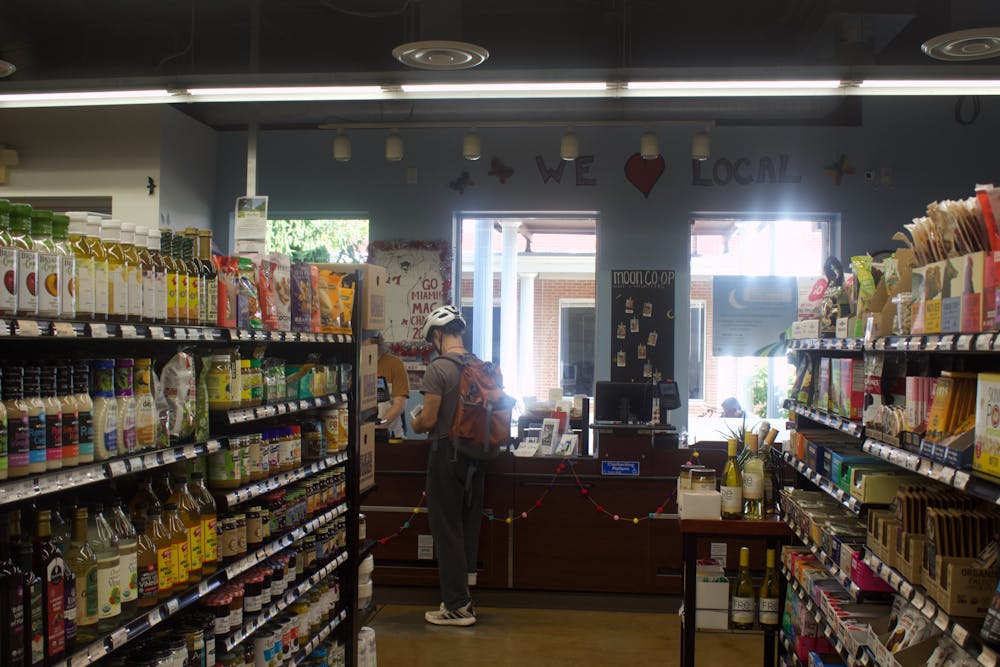 <p>A customer checks out at Oxford&#x27;s local organic grocery store, the MOON Co-op.﻿</p>