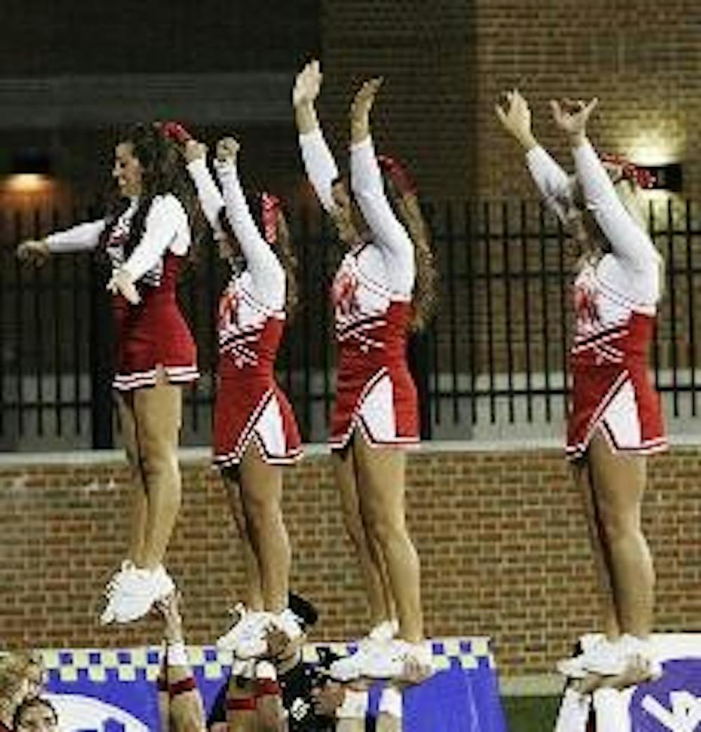The Miami cheerleading squad performs a routine at Sunday's homecoming game against Northern Illinois University.