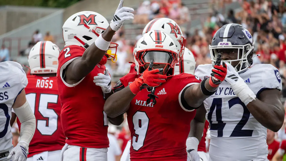Redshirt sophomore running back D'Shawntae Jones signals for a first down in game against the College of the Holy Cross