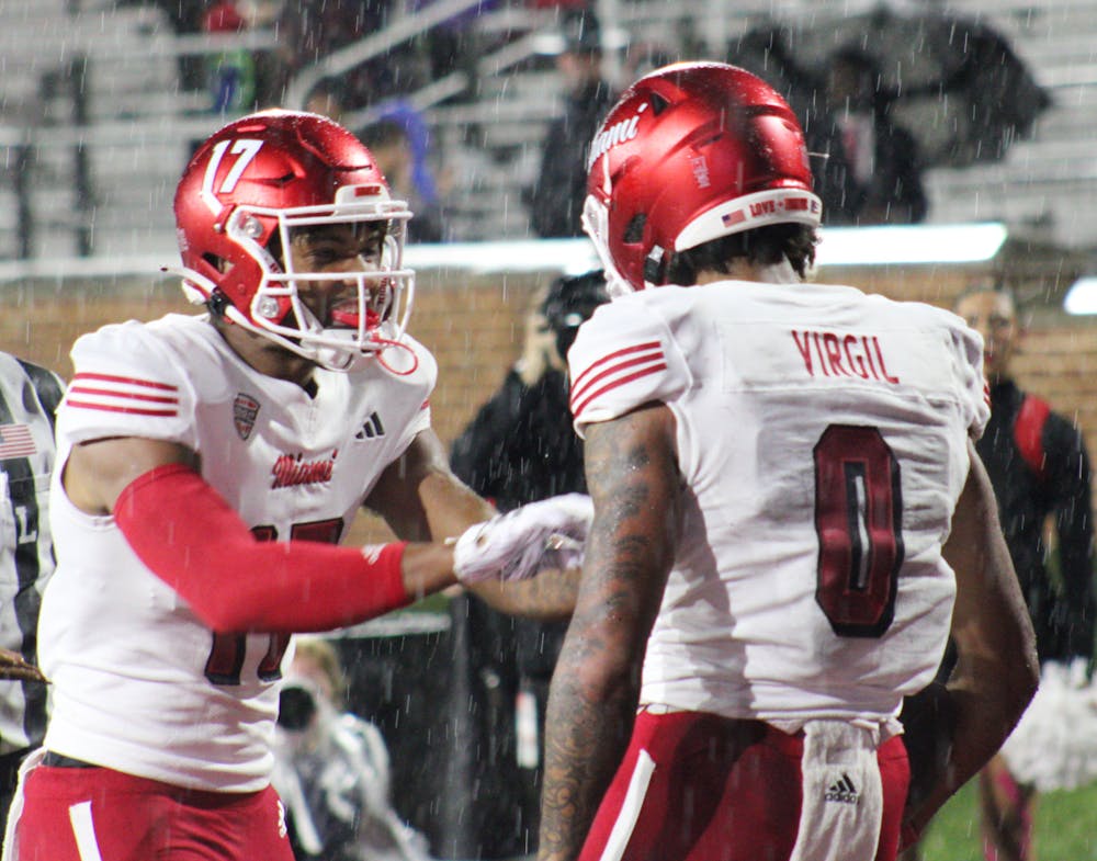 Reggie Virgil (right) finished the night with 101 receiving yards and one touchdown in the RedHawks' 27-21 win over Ball State