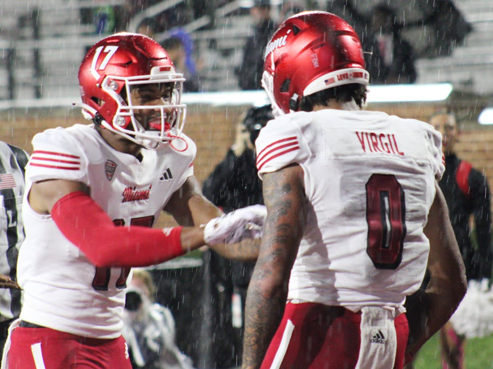 Reggie Virgil (right) finished the night with 101 receiving yards and one touchdown in the RedHawks' 27-21 win over Ball State