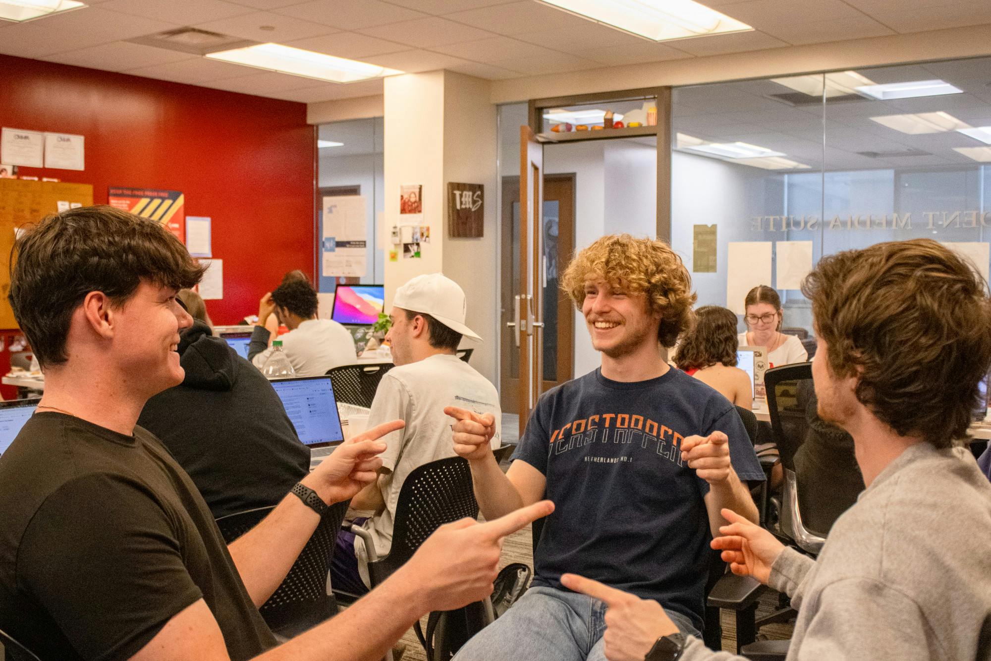 Kasey Turman points at his two biggest distractions in the newsroom, Sam Norton and Adam Smith.﻿