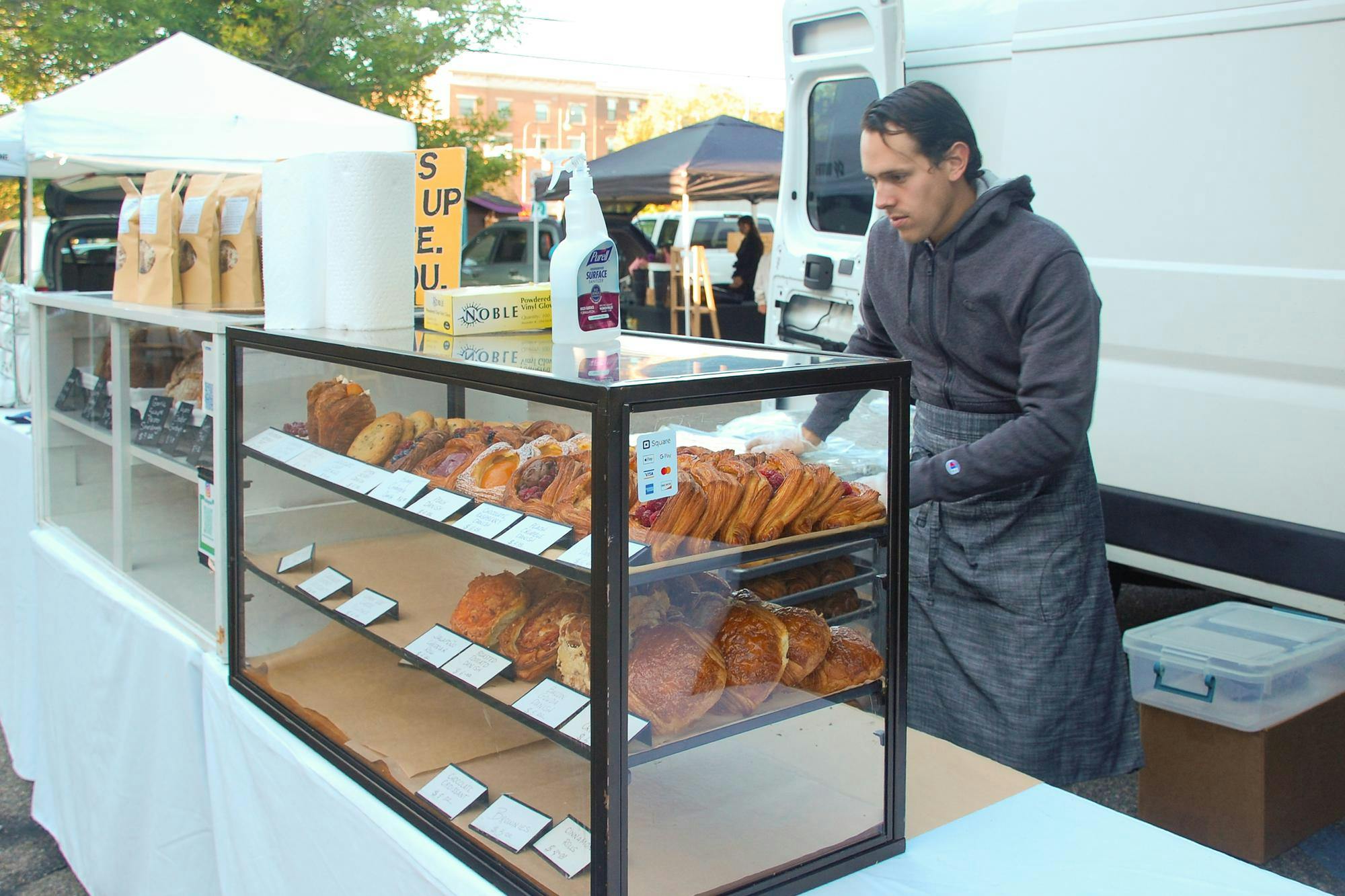 James Bigham sets up his stall early Saturday morning.