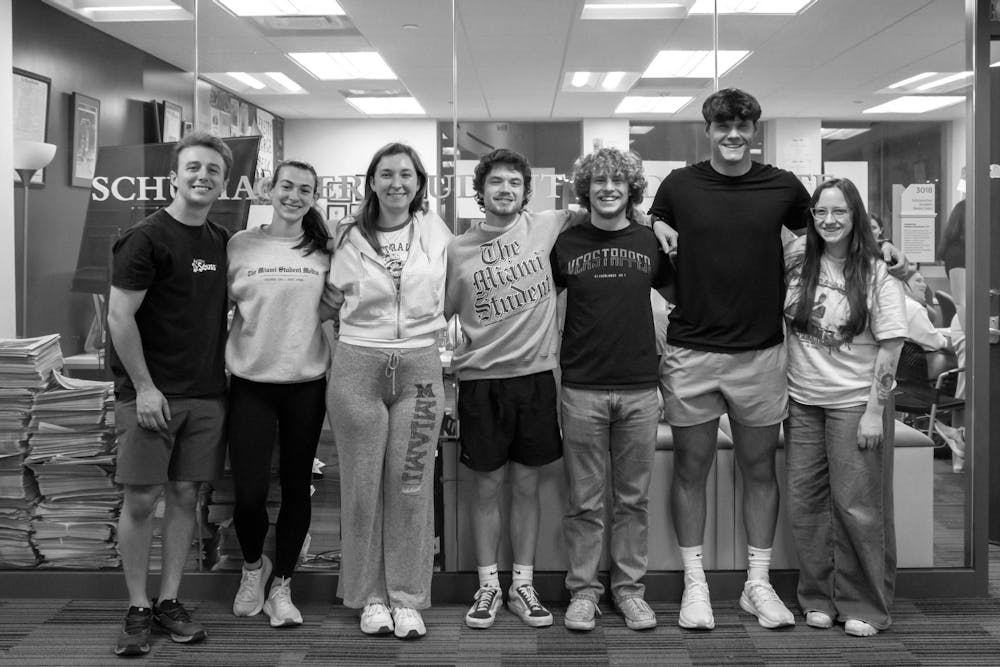 Sam Norton poses with the rest of the seniors outside the TMS newsroom