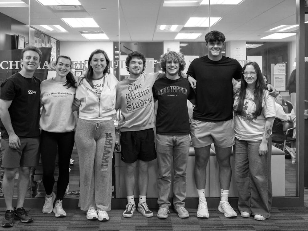 Sam Norton poses with the rest of the seniors outside the TMS newsroom