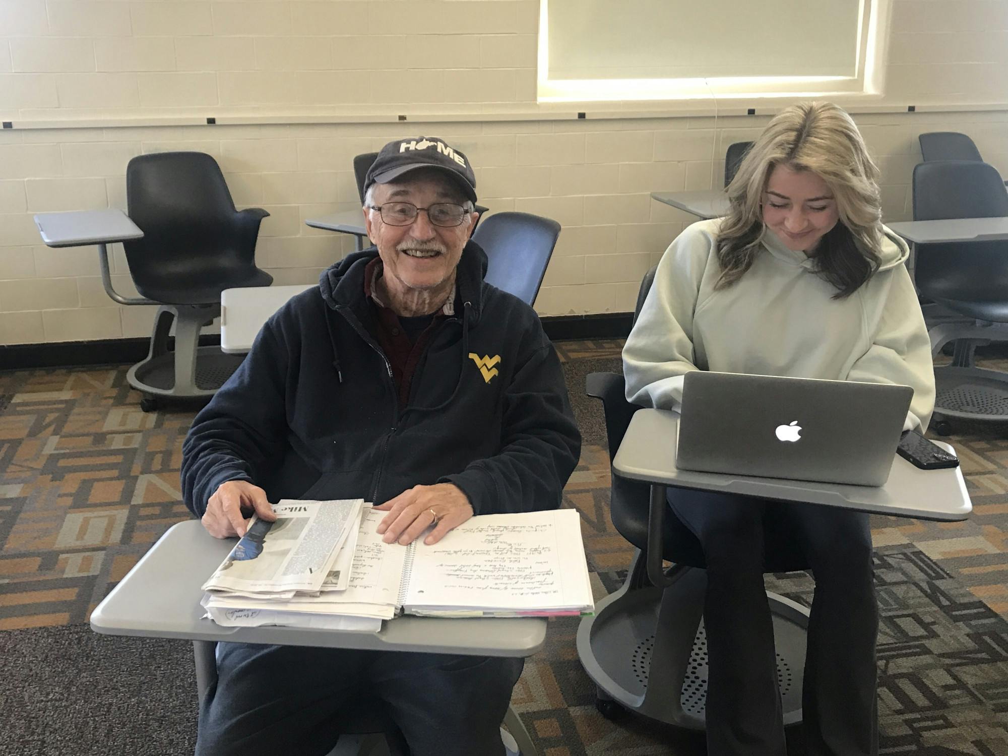 Lee Fisher sits with a fellow student in Upham Hall.