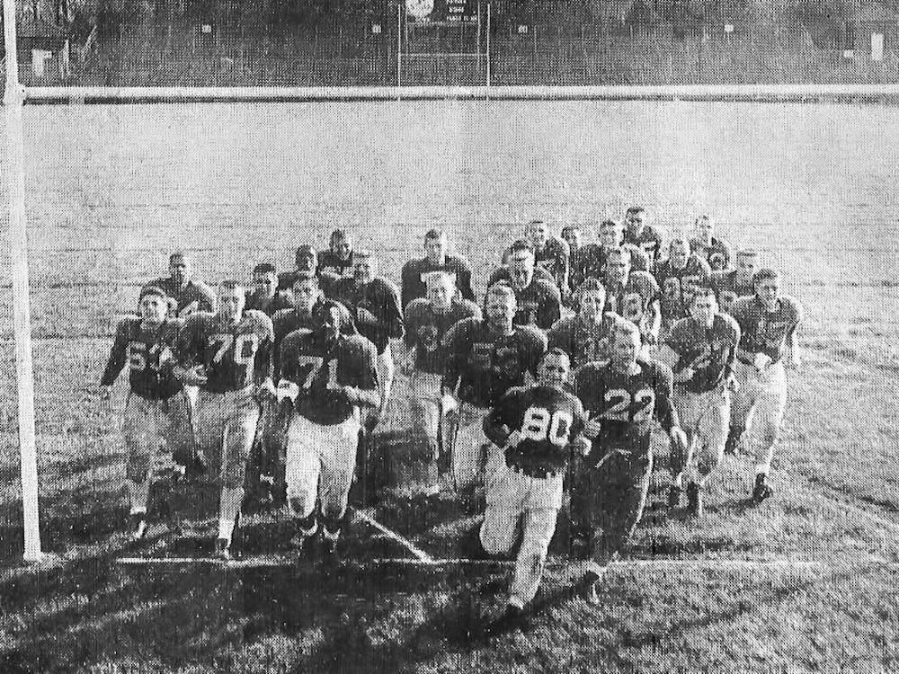 The 1956 Miami University football team poses after practice