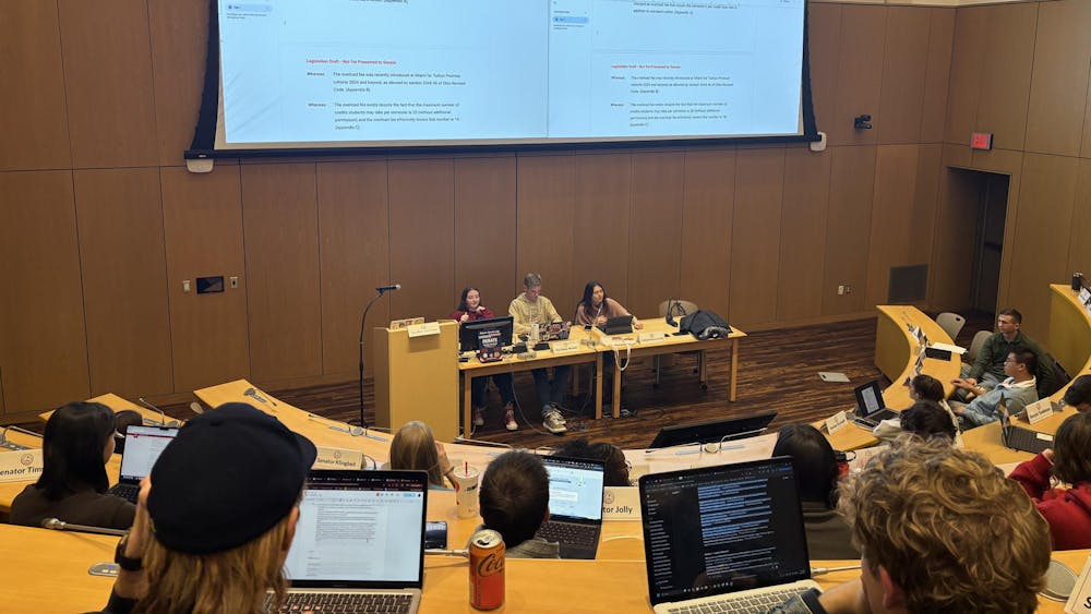 Senator Nick McClure introduced a revised proposal requesting the university reconsider its policy on course overload fees.