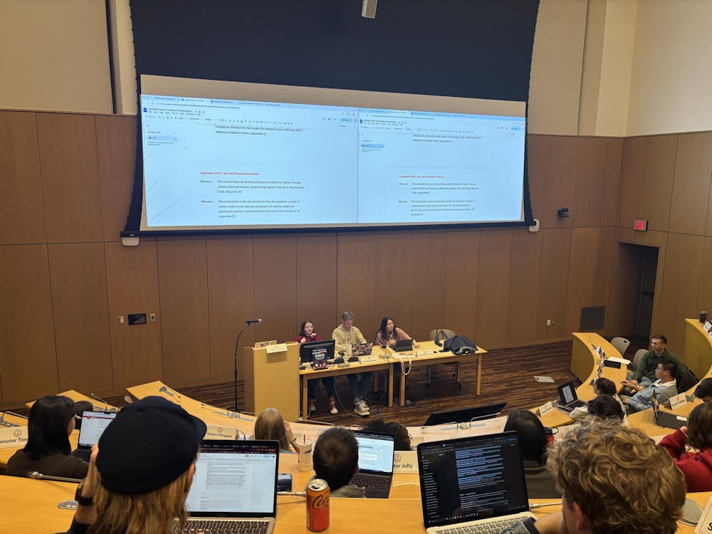 Senator Nick McClure introduced a revised proposal requesting the university reconsider its policy on course overload fees.