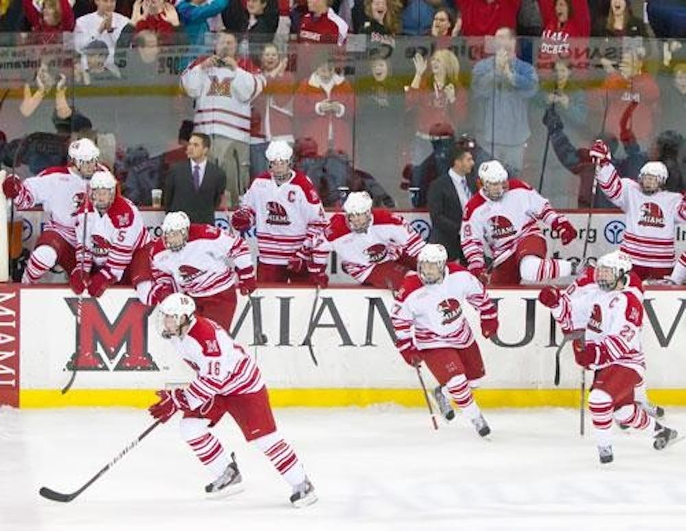 The Miami University Hockey team celebrates a shootout victory Nov. 12 against the University of Michigan. The Red and White are looking to bounce back against the Buckeyes after being swept by Northern Michigan University for the first time in over two years.